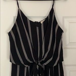 black and white body suit with slit up both legs